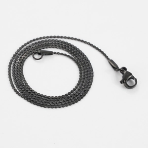 Detail of gunmetal black stainless steel S-link chain necklace with lobster clasp closure