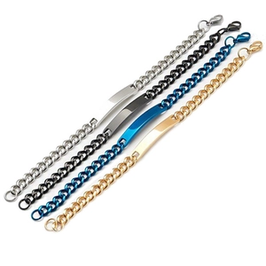Macro view of four polished stainless steel ID bracelets in silver black blue and rose gold