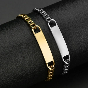 Close-up of gold and silver Cuban link ID bracelets with polished engravable bar details