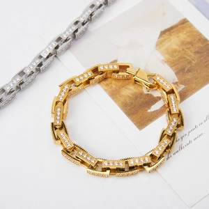 Detail of hip hop Cuban link bracelet with pavé cubic zirconia in gold and silver