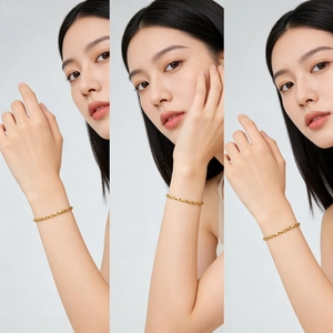 Detailed close-up of a minimalist 18K gold-plated oval link chain bracelet on a wrist