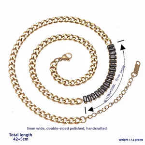 Macro view of 5mm 18K gold stainless steel Cuban chain with black zircon stone details