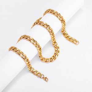 Macro detail of high-polished gold Cuban link chain with secure lobster clasp