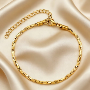 Minimalist 18K gold plated stainless steel snake chain bracelet on elegant silk