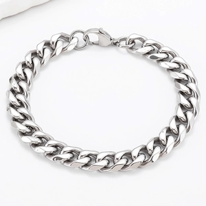 Close-up of flat curb chain links and lobster clasp on silver stainless steel bracelet