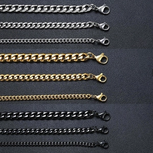 Detail of Cuban link bracelets in silver, gold, and black finishes with lobster clasps