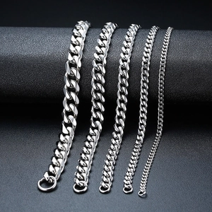 Macro view showing five different widths of polished stainless steel Cuban link chains