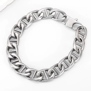 Macro view of silver stainless steel anchor link bracelet with large lobster claw clasp