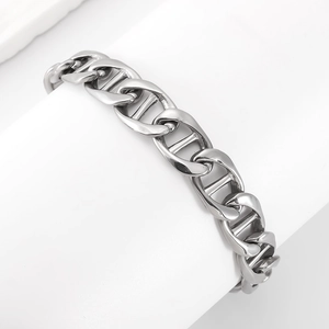 Macro detail of silver stainless steel pig nose chain link bracelet on white display stand