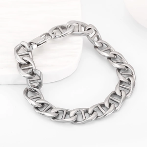 Detail of silver stainless steel mariner link chain bracelet with a secure fold-over clasp
