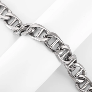 Detailed macro view of silver stainless steel anchor chain bracelet with industrial links