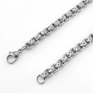 Silver stainless steel chain necklace with embossed geometric patterns and lobster clasp