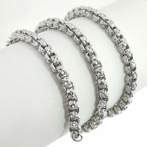 Polished stainless steel square link chain necklace with detailed embossed star textures