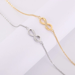 Bracelet infini en acier titane avec diamants étincelants en finitions or et argent