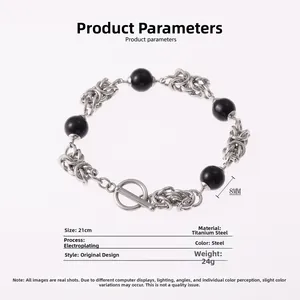 Detailed view of titanium steel cross bracelet with 8MM black obsidian beads and T-clasp