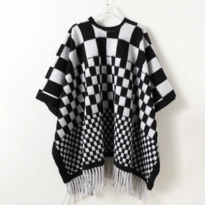 Retro black and white checkerboard knit shawl poncho with fringe tassels for winter warmth