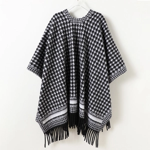 Classic houndstooth knit shawl with black tassels and warm cashmere-like finish