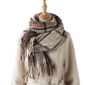 Classic brown plaid cashmere-like thick scarf with tassels on white mannequin