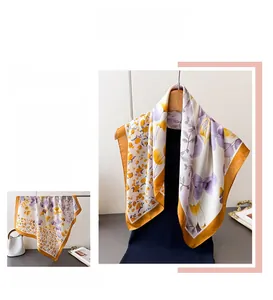 Detailed pattern of floral silk scarf featuring purple leaves and yellow tulips