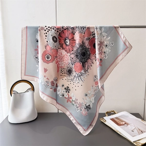 Detailed view of nature floral print silk square scarf with sunflower and daisy patterns