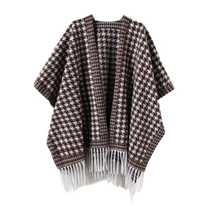 Classic brown houndstooth shawl cape with white tassels and autumn cashmere texture