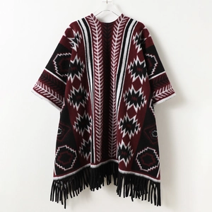 Ethnic geometric cashmere-like poncho with red black patterns and tassel fringe detail