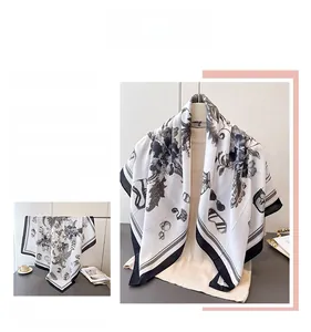 Detailed pattern of floral silk square scarf with vintage sunglasses print and herringbone texture