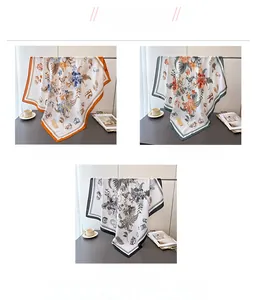 Detailed view of square silk scarves with vintage floral prints in three color options