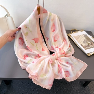 Pink silk-satin scarf with tulip floral print styled as a wrap with fashion accessories