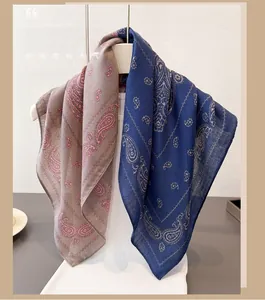 Detail of paisley pattern cotton-linen blend scarves in burgundy and navy blue colors