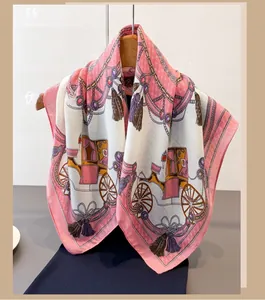 Detailed close-up of retro silk scarf featuring vintage carriage and gold chain patterns