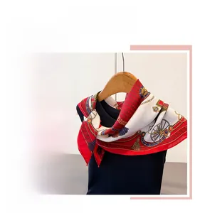 Detail of red and white silk scarf featuring vintage carriage and chain prints