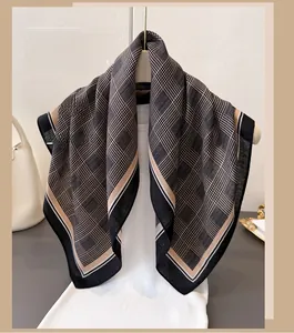 Classic plaid checkered cotton linen scarf hanging on a stand with elegant drapery
