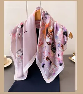 Close-up of floral pattern silk scarf draped on a wooden hanger for a soft elegant look