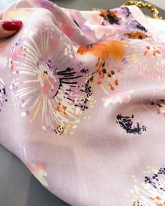 Close-up of light purple floral scarf showing herringbone weave and soft silk texture