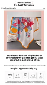 Detailed view of floral silk-feel satin scarf with orange borders and fabric specifications