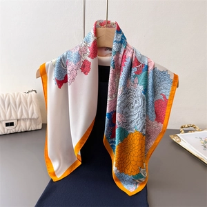 Floral print faux silk square scarf in ivory with orange border and elegant blooms