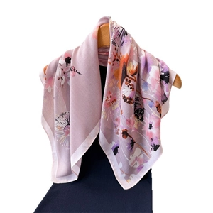 Floral print lavender cotton linen scarf displayed on a wooden hanger with white background