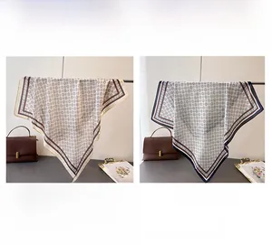 Detail view of two vintage geometric patterns on smooth faux silk square scarves