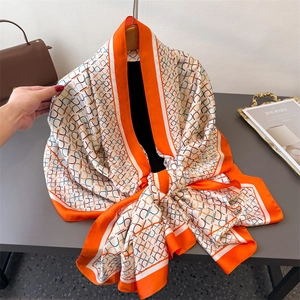 Orange and ivory geometric chain print faux silk scarf shawl for sun protection