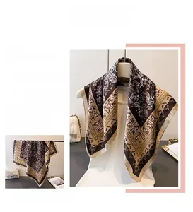 Close-up of vintage baroque patterned silk scarf showing delicate texture and elegant print