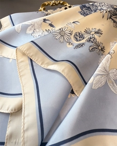 Close-up of elegant daisy silk scarf with premium twill texture and floral pattern