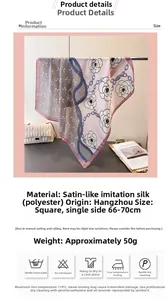 Detail view of pink satin silk scarf with camellia and chain patterns on a bag
