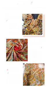 Detailed view of paisley printed silk-like scarf showing vibrant colors and fine edge stitching