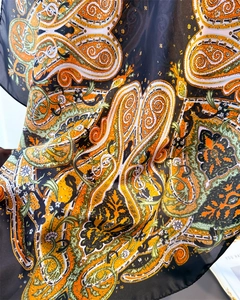 Macro shot of exotic paisley pattern on lightweight translucent silk scarf fabric
