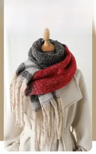 Close-up of winter thick scarf with floral pattern gradient knit and long tassels