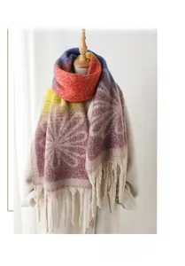 Detailed view of floral pattern and thick tassels on cashmere-feel gradient shawl
