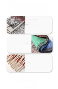 Close-up of fringe details and soft wool-rich floral pattern on a winter scarf