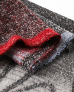 Detailed macro view of the soft brushed texture on a vintage floral cashmere-like scarf