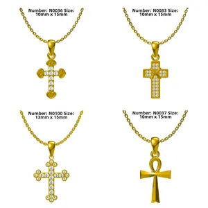Detail view of four gold-plated cross pendants with cubic zirconia, size 10-13mm wide